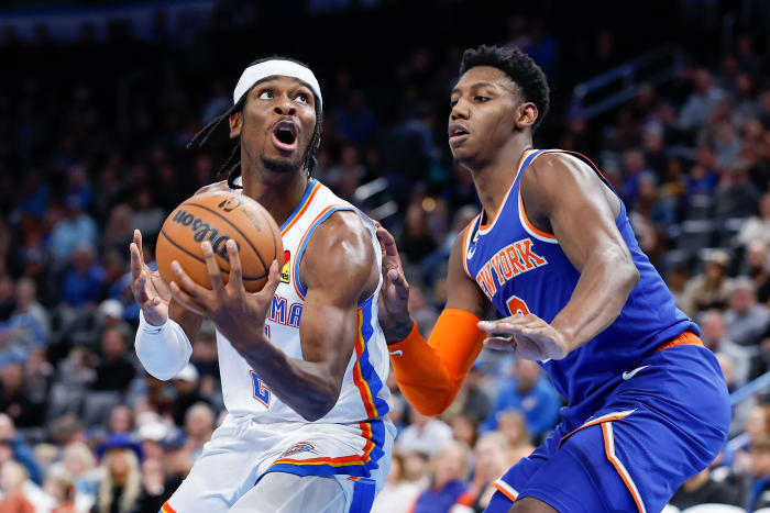 Nov 21, 2022; Oklahoma City, Oklahoma, USA; Oklahoma City Thunder guard Shai Gilgeous-Alexander (left) controls the ball against New York Knicks guard RJ Barrett (right) during the second half at Paycom Center. New York won 129-119. Mandatory Credit: Alonzo Adams-USA TODAY Sports